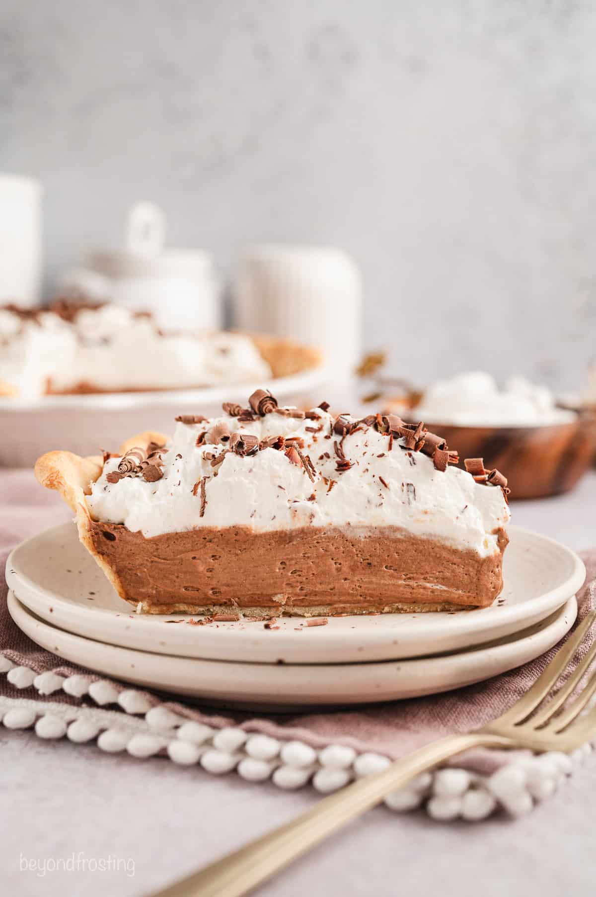 A slice of French silk pie on a plate.