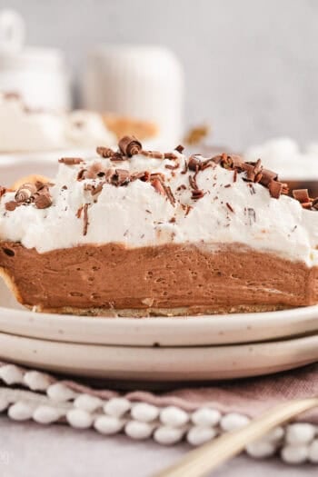 A slice of French silk pie on a plate.