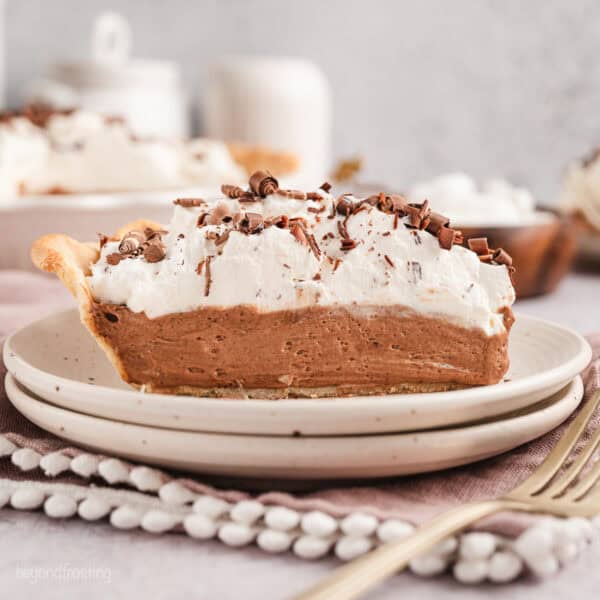 A slice of French silk pie on a plate.