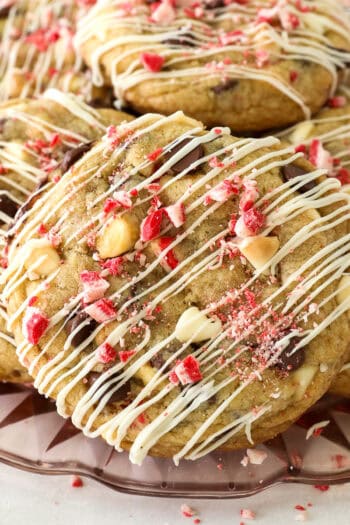 Close up of peppermint chocolate chip cookies piled on a glass plate.