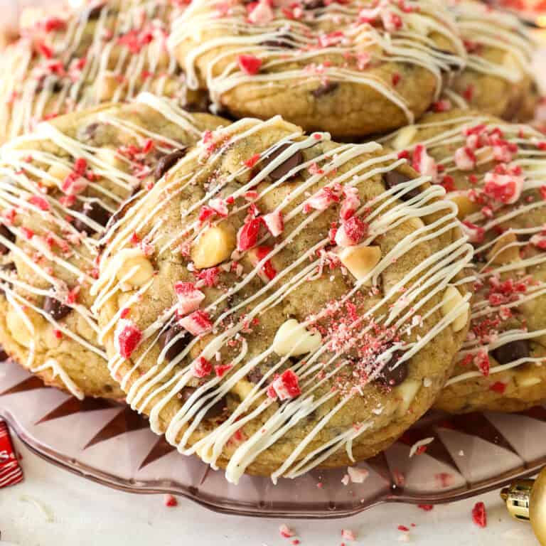 Close up of peppermint chocolate chip cookies piled on a glass plate.