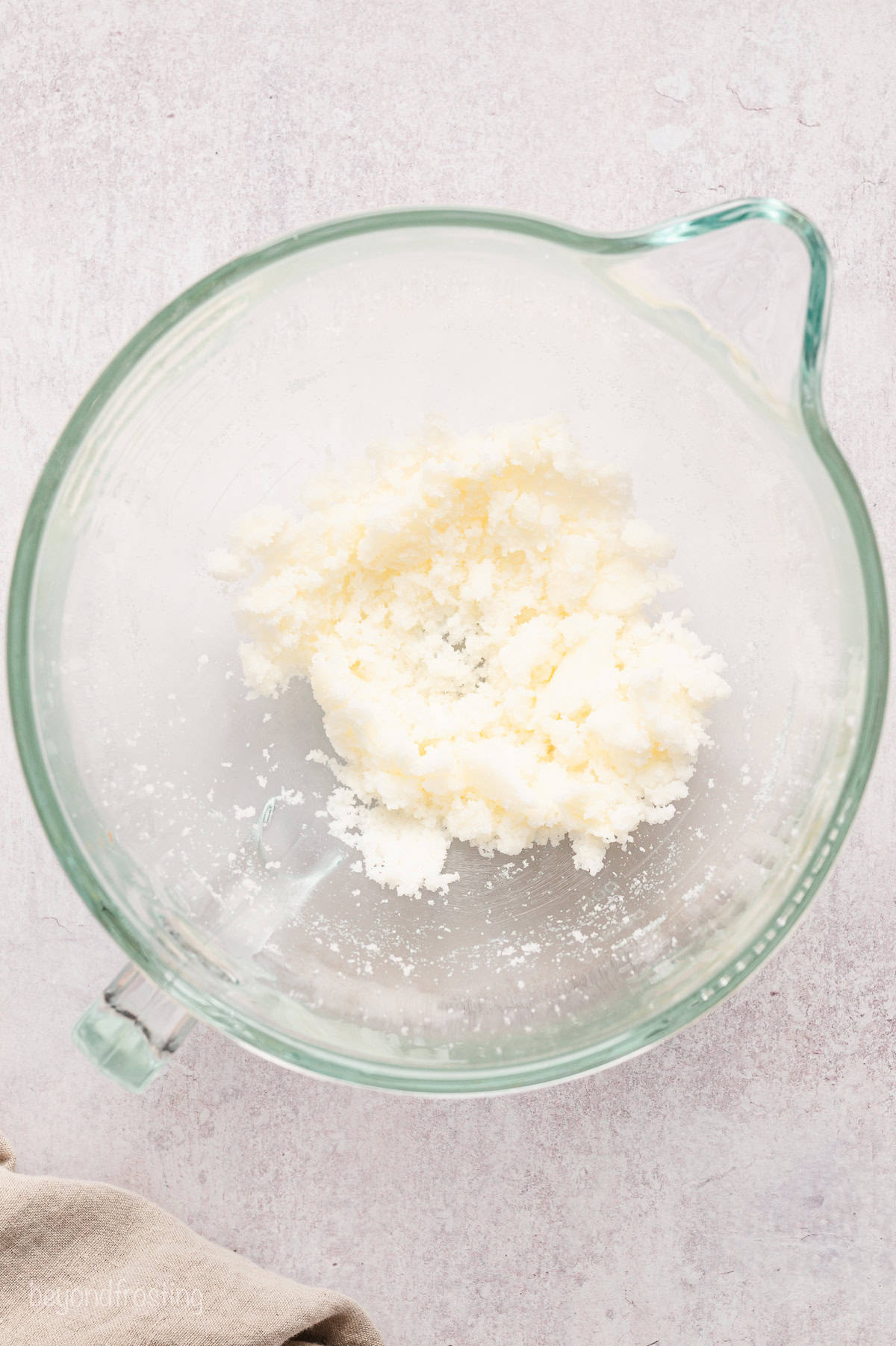 Sugar, butter, and shortening beaten together in a mixing bowl.