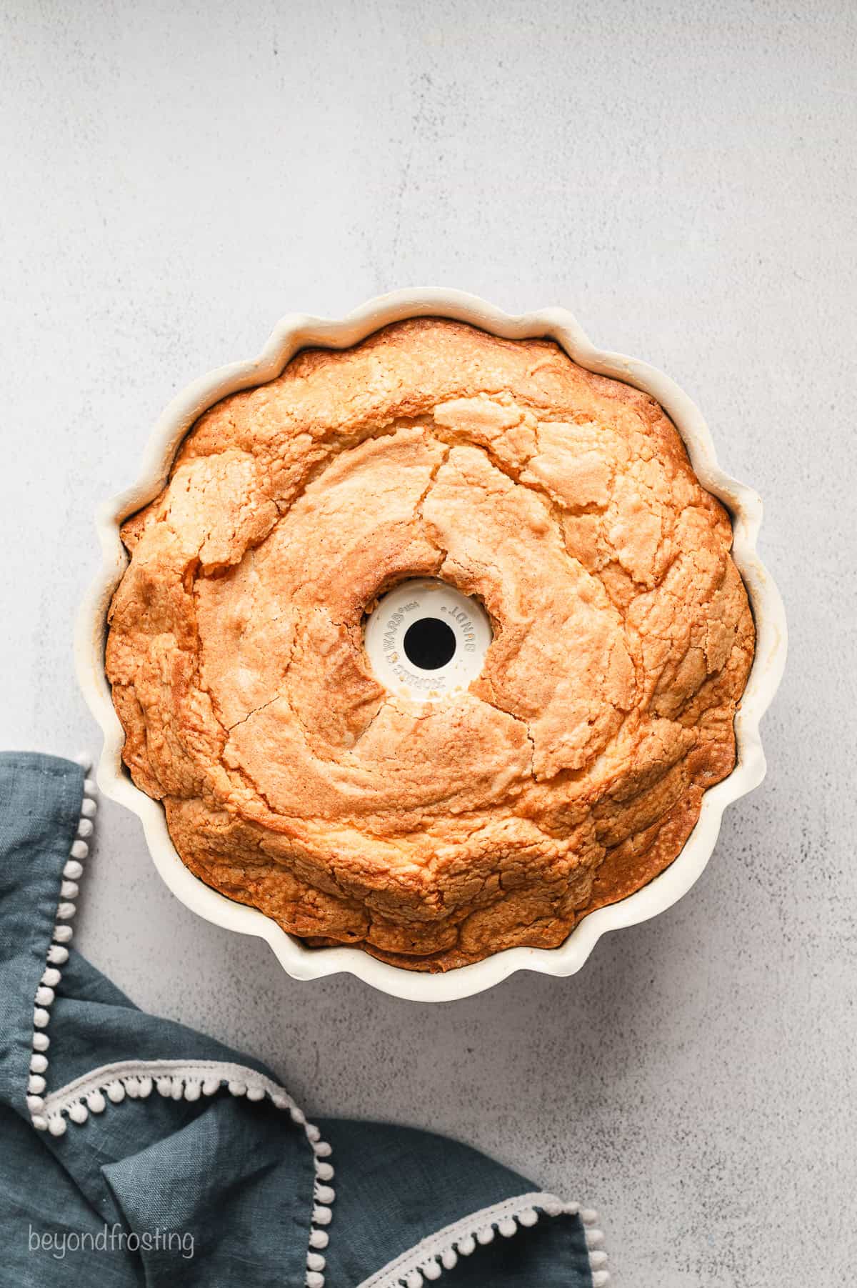 Baked cream cheese pound cake inside a bundt pan.