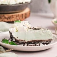 A slice of grasshopper pie on a plate.