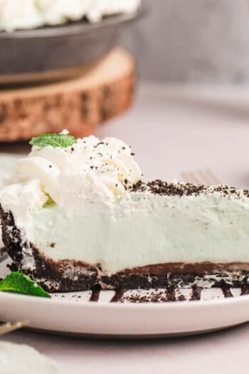 A slice of grasshopper pie on a plate.