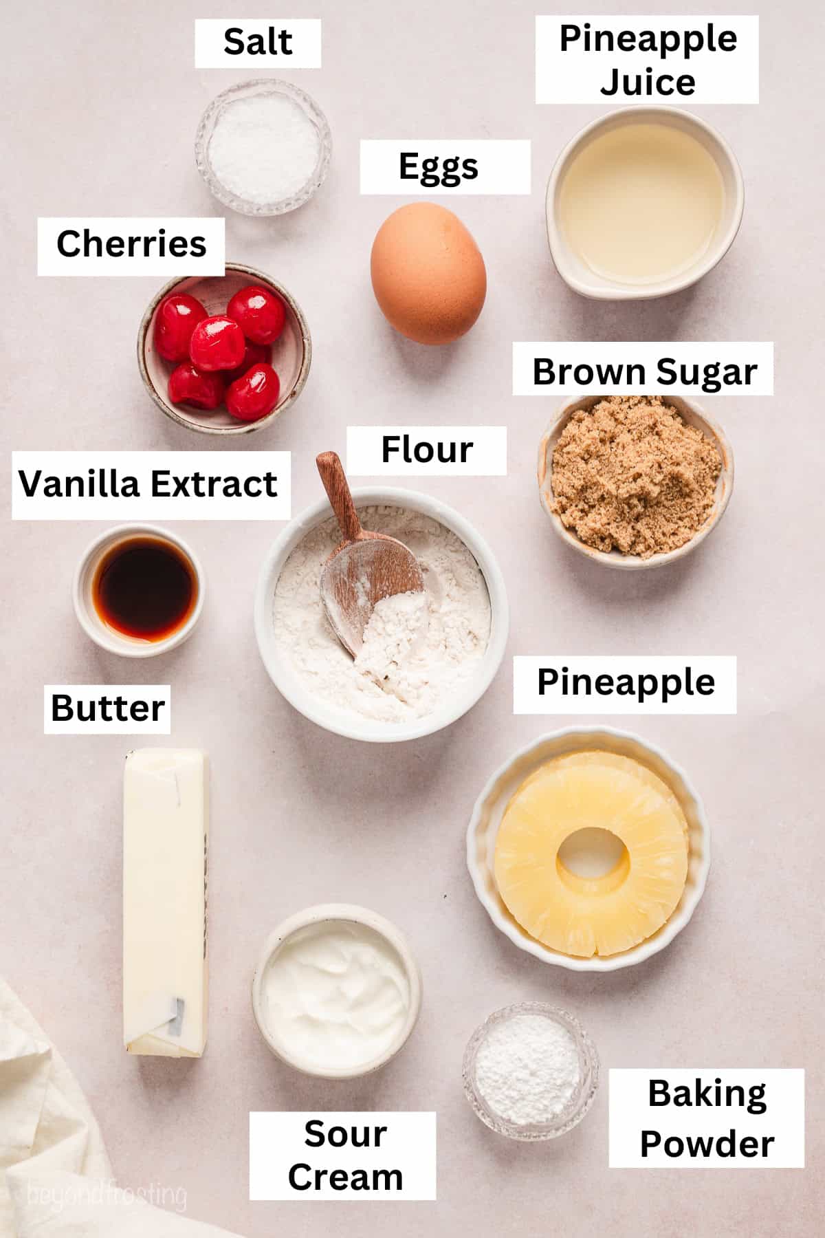 Pineapple upside down cake ingredients with text labels overlaying each ingredient.