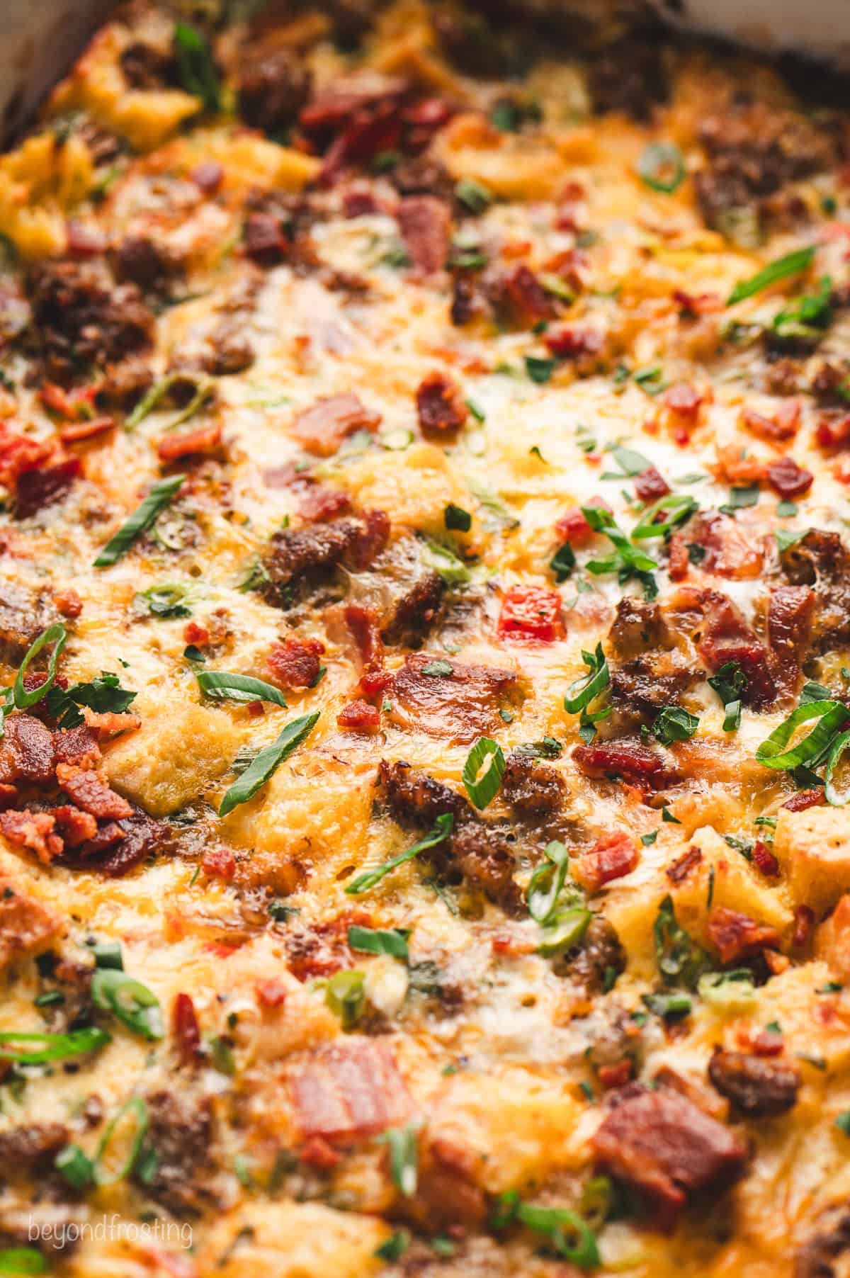 Close up of a breakfast egg casserole in a baking dish.