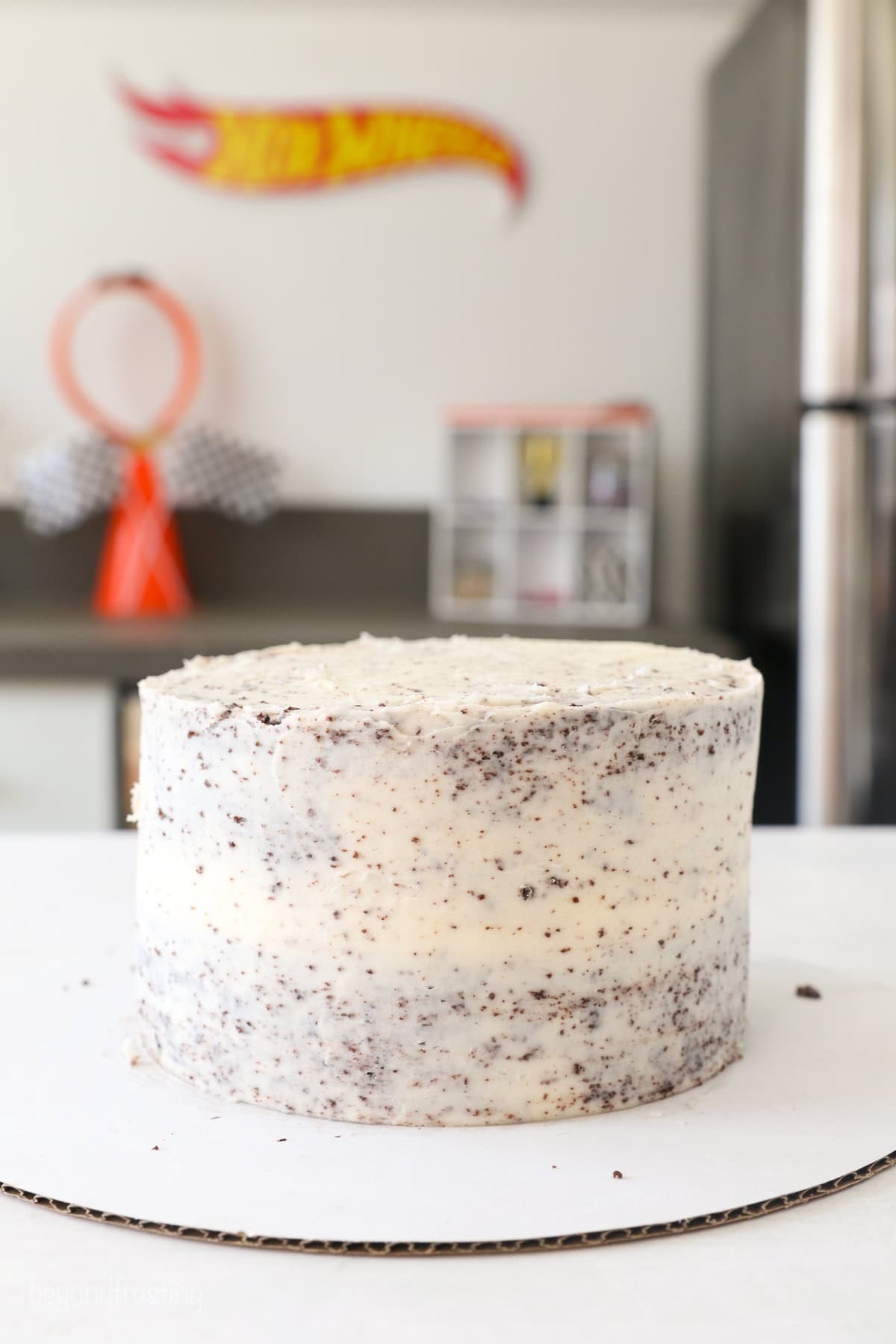A layer cake covered with a crumb coat.