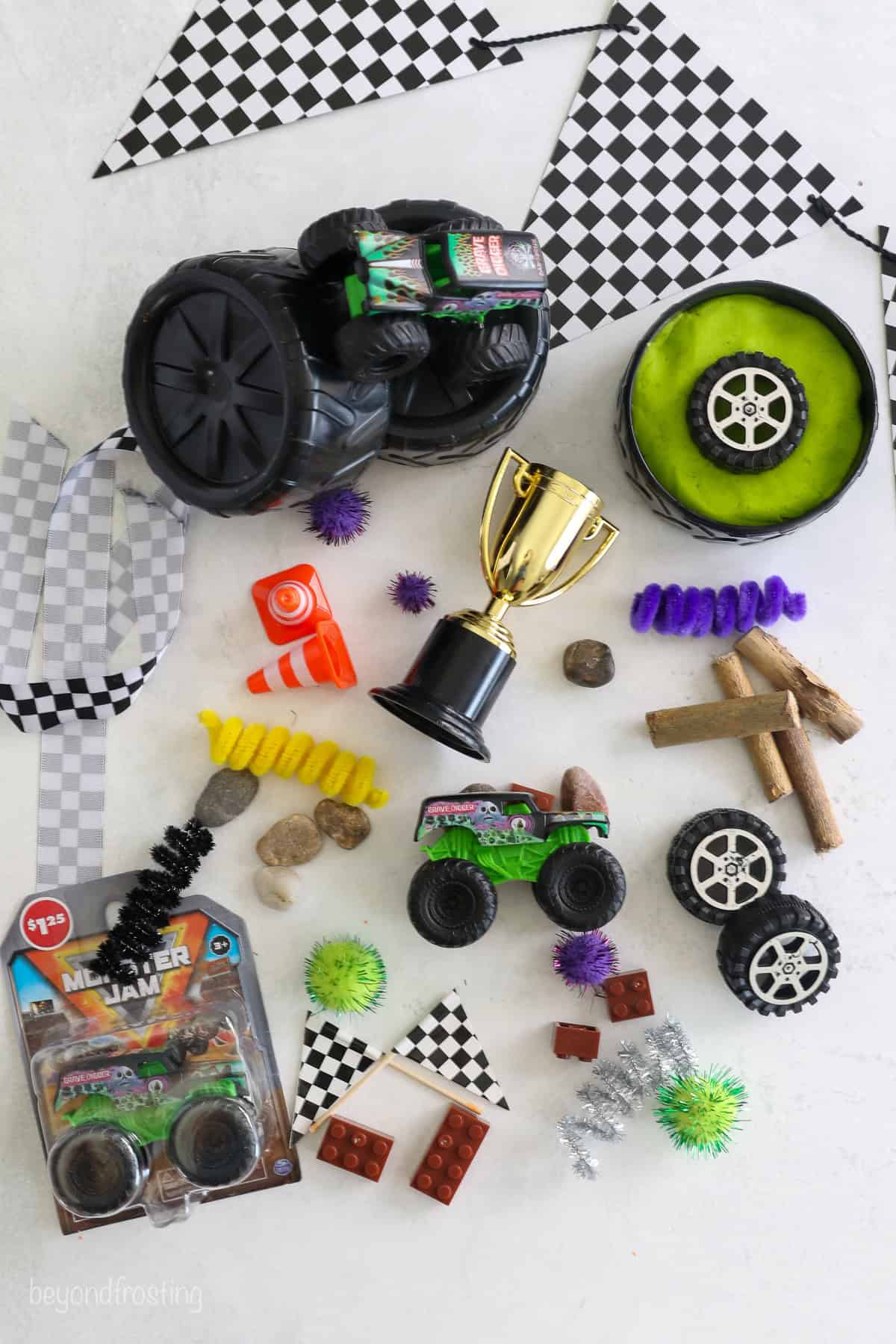 Overhead view of Monster Jam play dough kit contents for a Gravedigger themed kit.