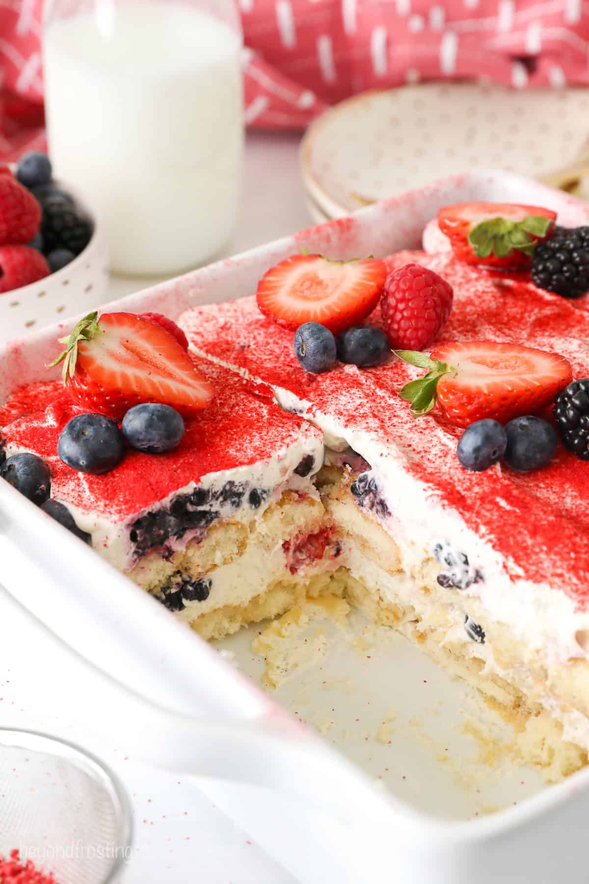A peek inside the pan of Berry Tiramisu showing the layers