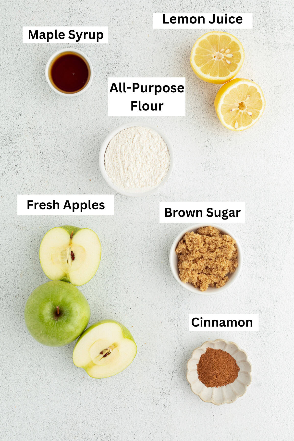 Homemade apple pie filling ingredients with text labels overlaying each ingredient.