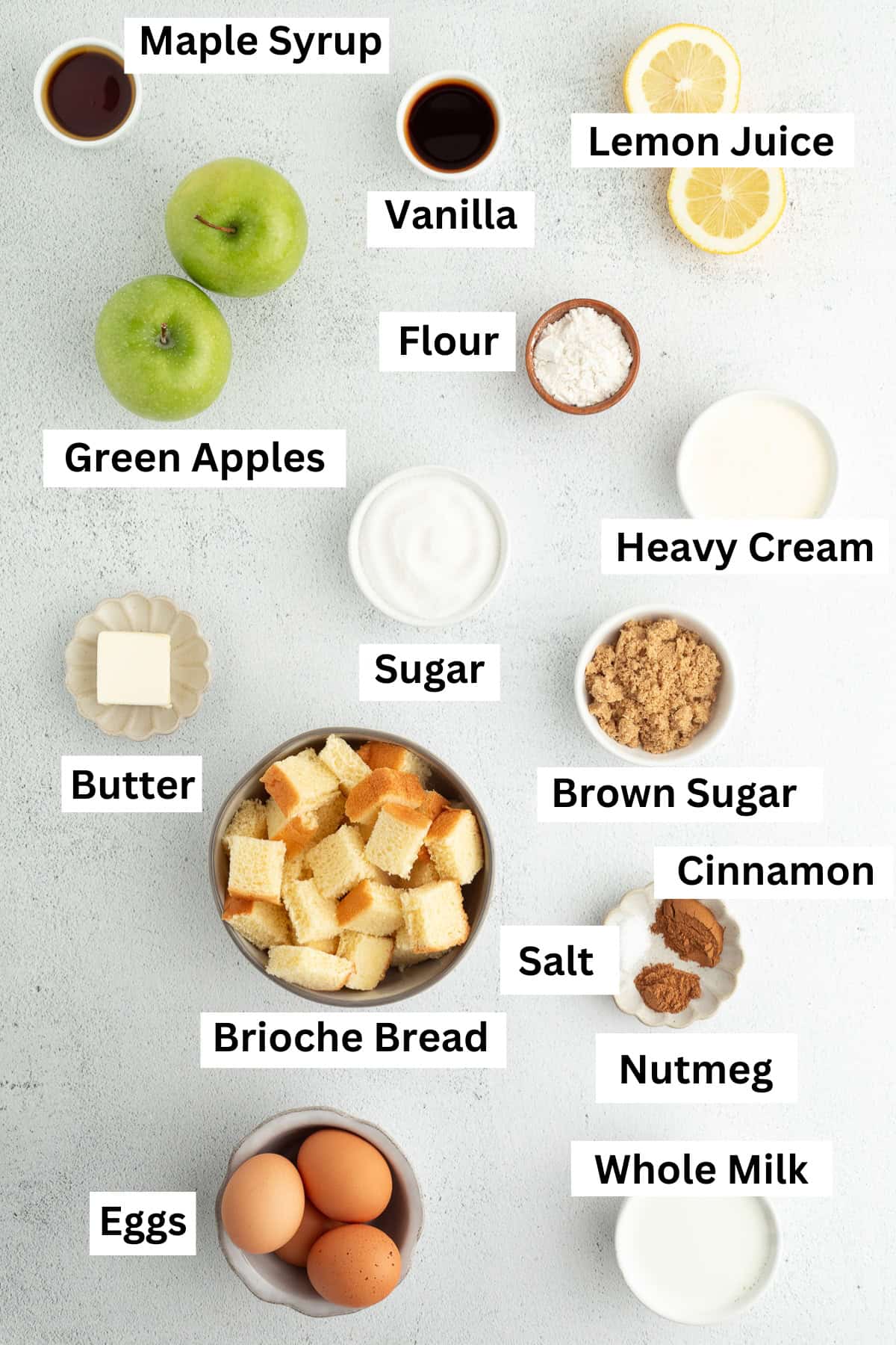 Apple bread pudding ingredients with text labels overlaying each ingredient.
