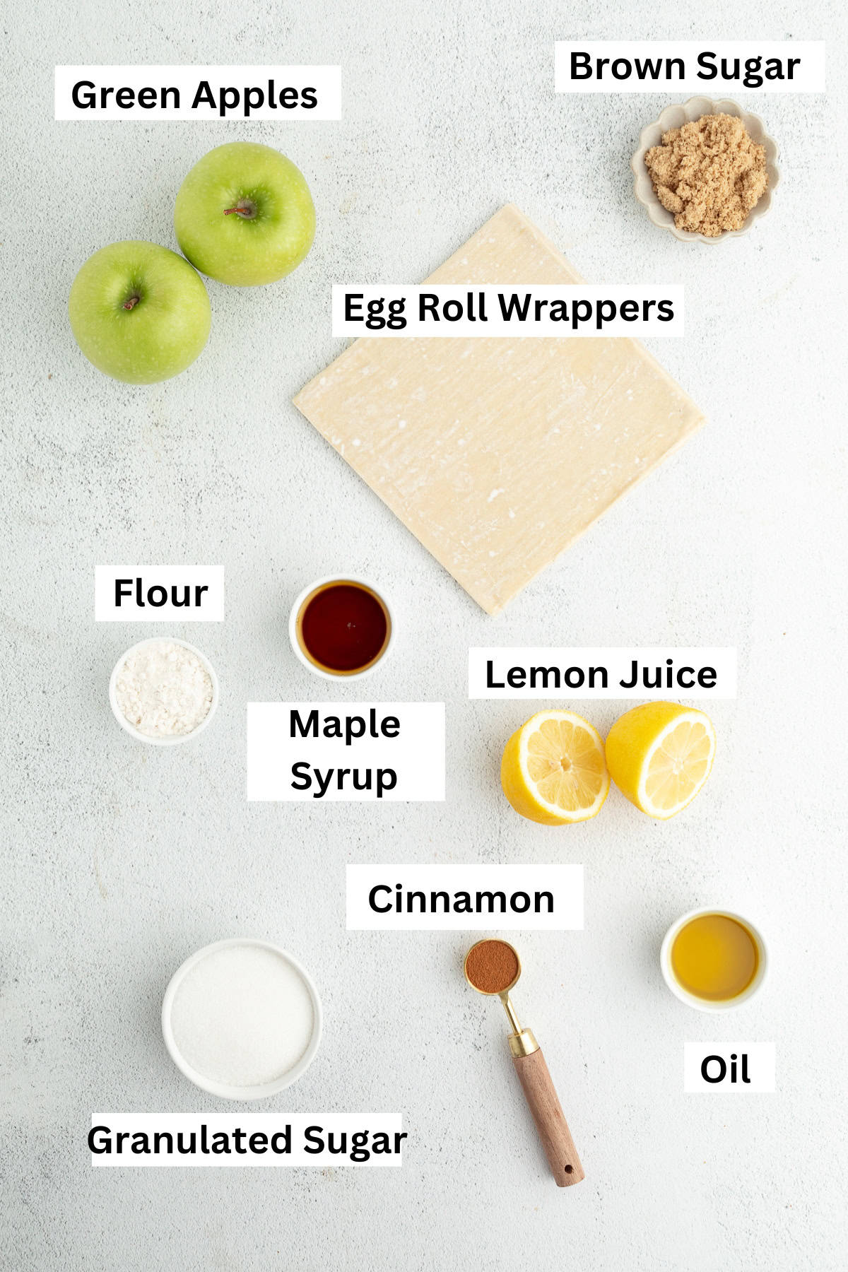 These apple pie egg rolls are golden, crispy egg roll wrappers bursting with homemade apple pie filling. Make them in the oven or air fryer! Apple pie egg rolls ingredients with text labels overlaying each ingredient.