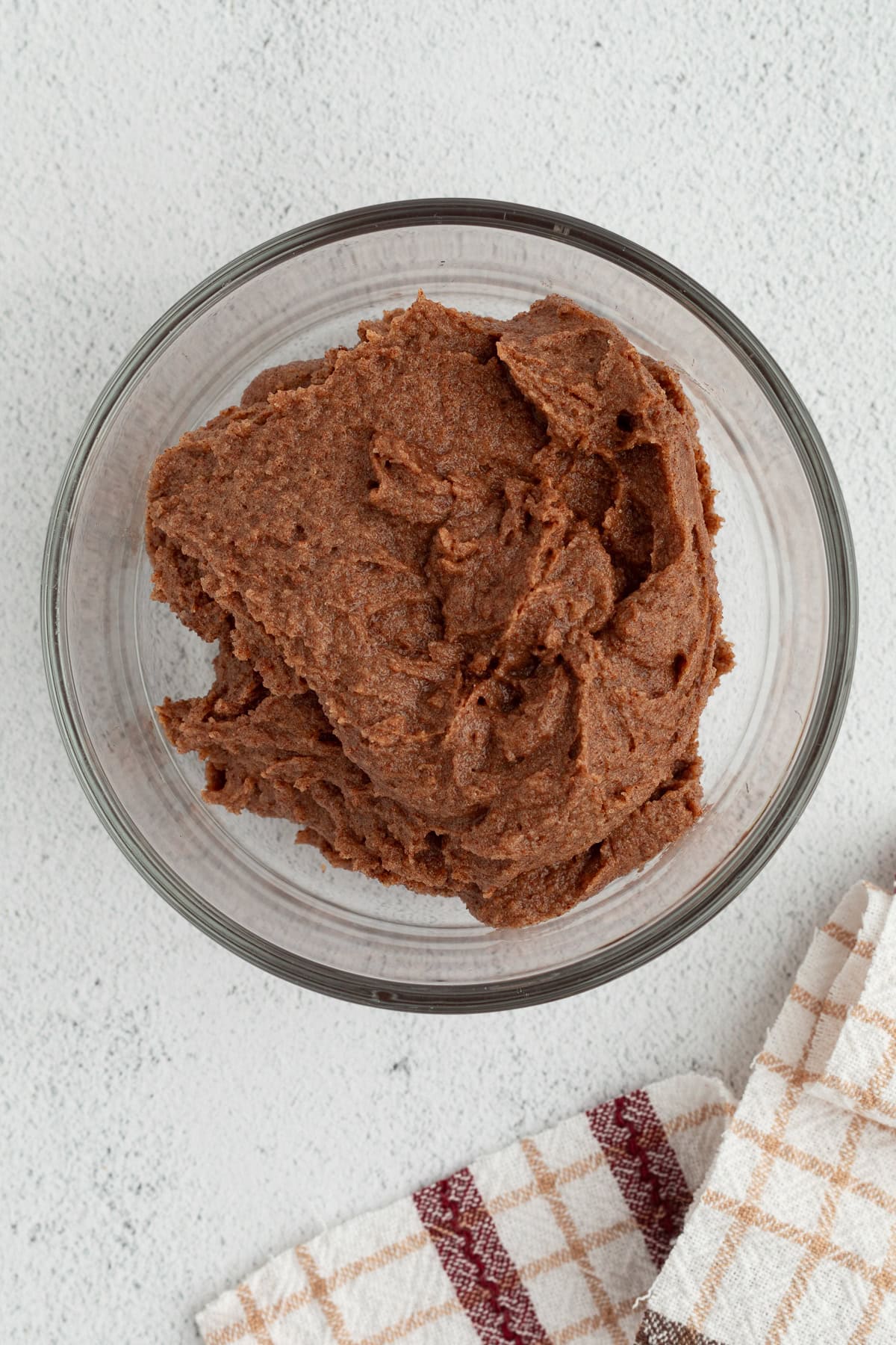 These homemade sticky buns are filled with warm cinnamon and nutty pecans, with a gooey caramel topping. The dough needs just 1 hour to rise! Butter, cinnamon, and brown sugar filling in a mixing bowl.
