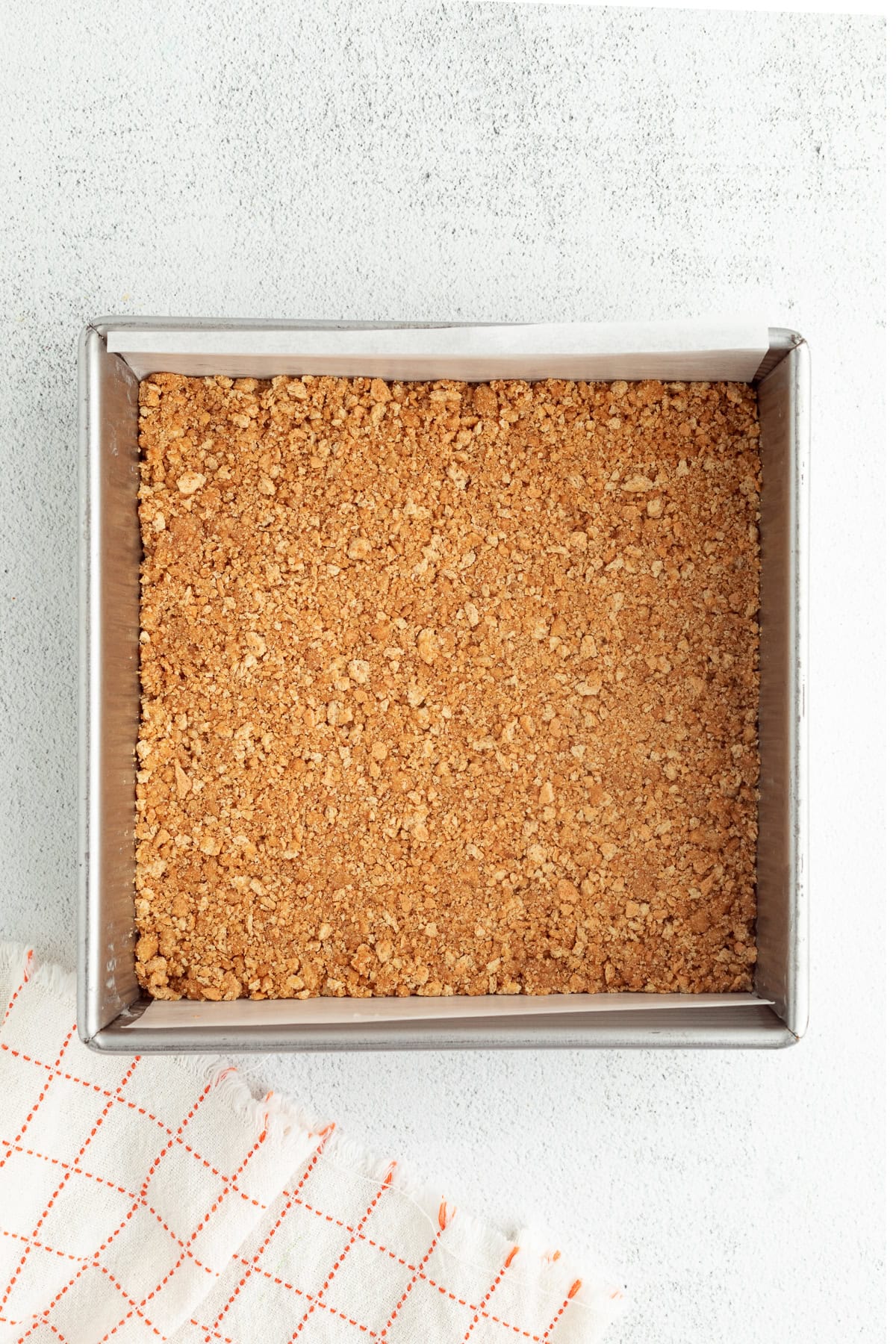 Strawberry cheesecake bars are easier to bake than a classic cheesecake, with a buttery crust and rich filling swirled with strawberry sauce! Graham cracker crust pressed into the bottom of a lined square pan.