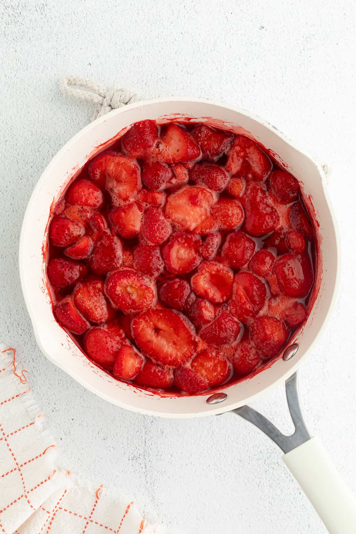 Strawberry cheesecake bars are easier to bake than a classic cheesecake, with a buttery crust and rich filling swirled with strawberry sauce! Strawberries simmered with sugar and lemon juice in a saucepan.
