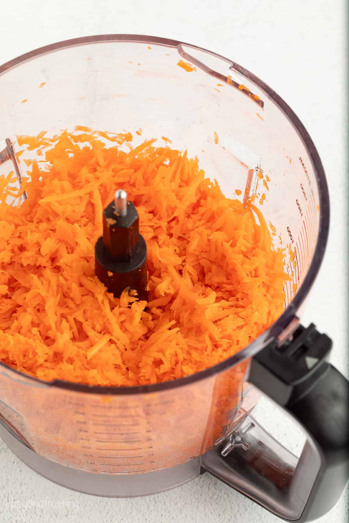 Sweet, moist carrot cake muffins are full of carrot cake flavor! They're easy to make, with the option to add a sweet cream cheese filling. Shredded carrot in a food processor.