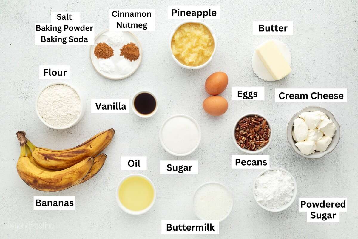 Hummingbird cake is a soft, spiced Southern layer cake with sweet banana, crushed pineapple, crunchy pecans, and cream cheese frosting. Hummingbird cake ingredients with text labels overlaying each ingredient.