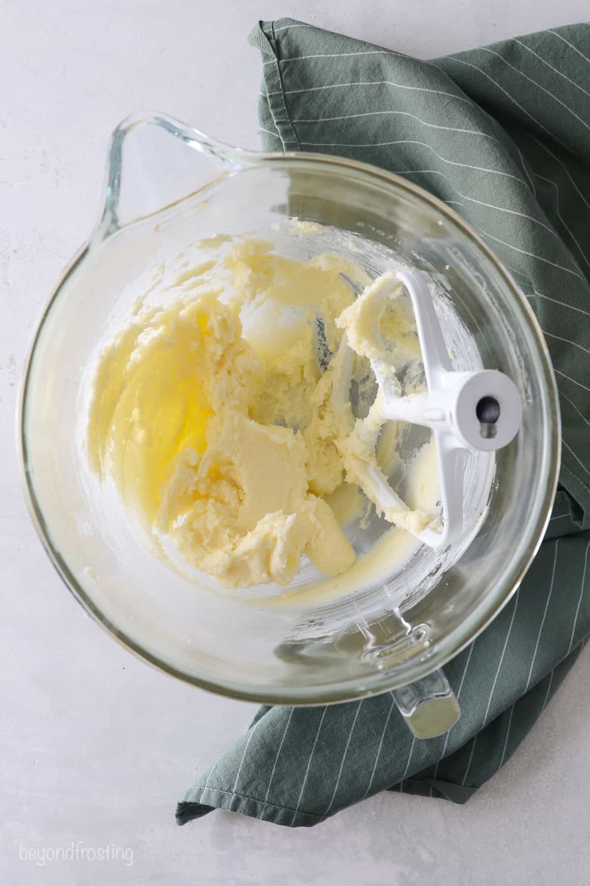 Creamed butter and sugar in a micing bowl.