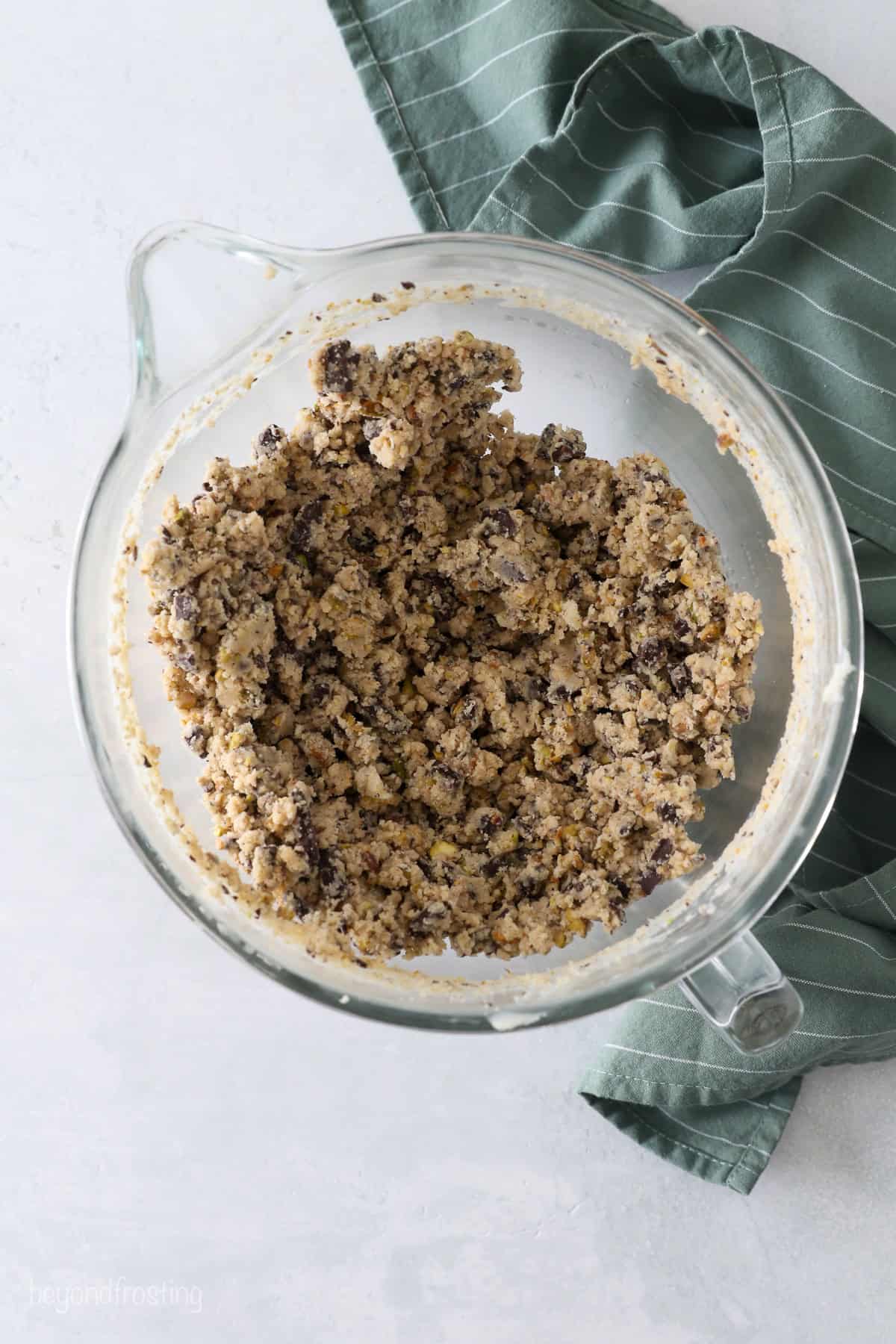 Pistachio shortbread cookie dough in a mixing bowl.