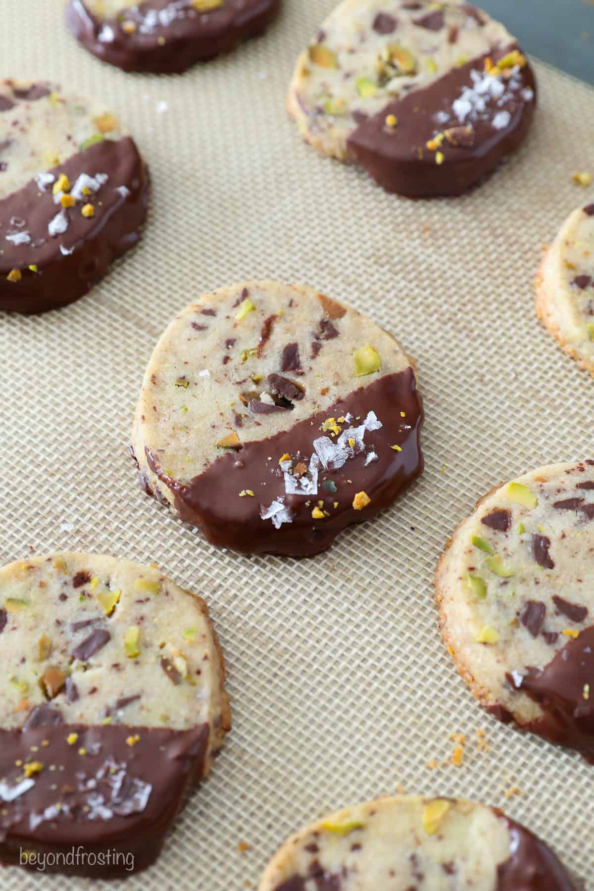 Rows of chocolate pistachio shortbread cookies.